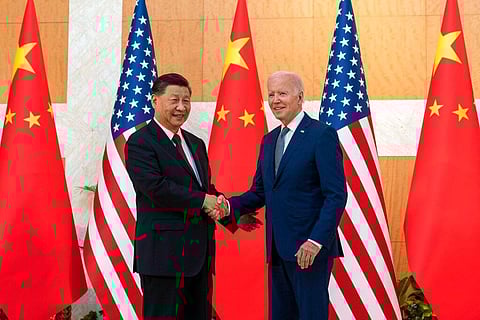 US President Joe Biden (R) and Chinese President Xi Jinping shake hands before a meeting on the sidelines of the G20 Summit in Bali, Nov 14, 2022. (Photo | AP)