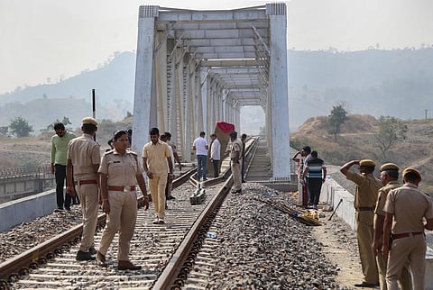 Police personnel investigate after an explosion on Udaipur-Ahmedabad railway track in Udaipur. (Photo | PTI)