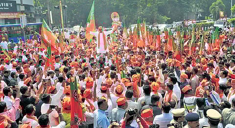 BJP candidate Harsh Sanghvi during a procession to file his nomination papers for the upcoming Gujarat Assembly elections in Surat on Monday. (Photo | PTI)