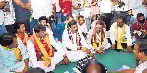 Union Minister Dharmendra Pradhan, BJP Padampur candidate Pradip Purohit and Bargarh MP Suresh Pujari with farmers | Express