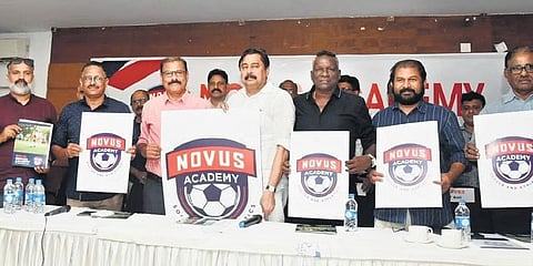 Sports Minister V Abdurahiman unveils the logo of Novus Soccer Academy in Malappuram on Monday