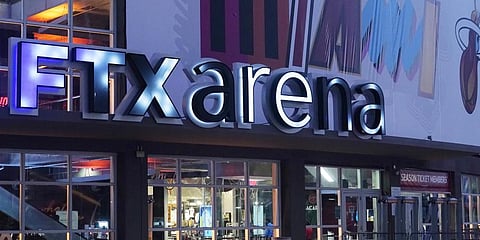 A sign for the FTX Arena, where the Miami Heat basketball team plays, is illuminated. (Photo | AP)