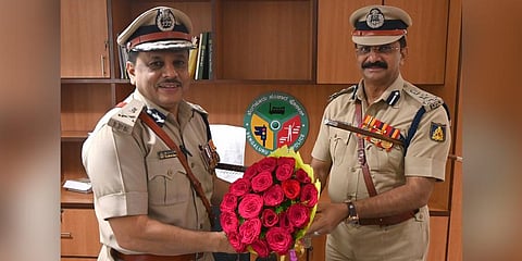 Joint Commissioner (Traffic) Ravikanthe Gowda greets ADGP MA Saleem who takes charge as Special Commissioner (Traffic) on Tuesday | Express
