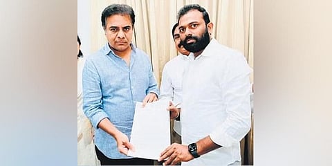 TSREDCO chairman Y Sathish Reddy hands over a memorandum to IT & Industries Minister KT Rama Rao