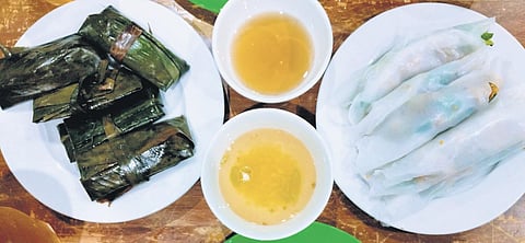 Soft rice paper rolls and banana leaf wraps stuffed with meat and veggies