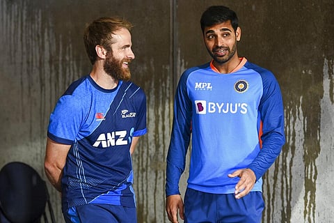 New Zealand captain Kane Williamson and India's Bhuvneshwar Kumar talk ahead of the first T20I game between India and New Zealand, in Wellington, Nov. 18, 2022. (Photo | AP)