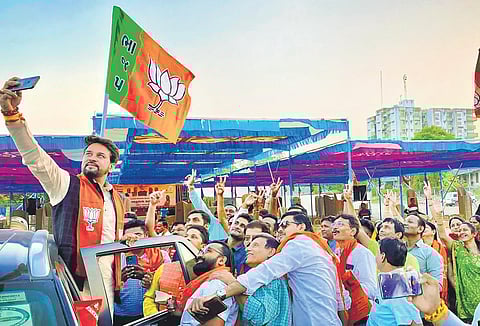 Union Minister Anurag Thakur at an election rally at Bardoli, Surat, on Friday. (Photo | PTI)