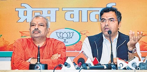 BJP MP Parvesh Verma with Delhi party chief Adesh Gupta on Tuesday |PTI