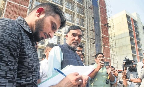 Minister Gopal Rai at the site of the BJP HQ on Tuesday, where Larsen & Toubro Ltd has been found of violating the ban on construction and demolition | Parveen Negi