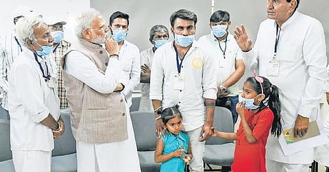 PM Narendra Modi meets family members of victims of the suspension bridge collapse, in Morbi on Tuesday. (Photo| PTI)