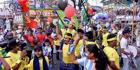 Fans celebrate ahead of the FIFA World Cup Qatar 2022, at Karukapalli in Kochi. (Photo | PTI)