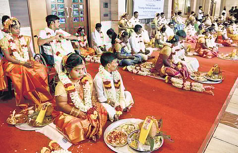 Fifty three couples exchanged garlands at a mass marriage held on Sunday | R Satish babu