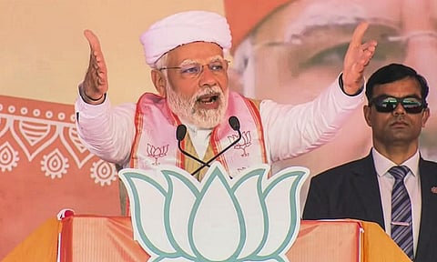 Prime Minister Narendra Modi speaks during a public meeting ahead of the Gujarat Assembly elections, at Dhoraji in Rajkot district. (Photo | PTI)