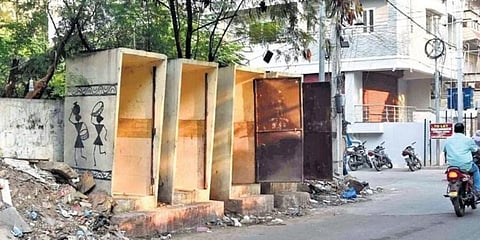 Public toilets lying defunct and without doors in city. (Photo | RVK Rao)