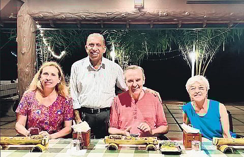 E K Harris with tourists from Spain at his homestay in Kannur | Express