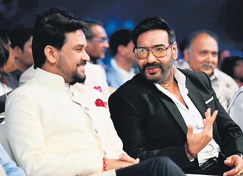 Union Minister for Information & Broadcasting and Youth Affairs & Sports Anurag Singh Thakur and Ajay Devgn at the inauguration of International Film Festival of India (IFFI) in Goa on Sunday; (inset)