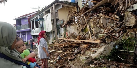 Residents inspect houses damaged by Monday's earthquake in Cianjur, West Java, Indonesia. (Photo | AP)