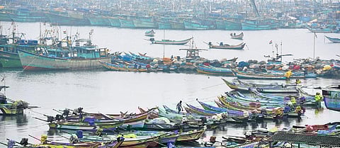 Amid varying predictions of heavy downpour on Monday and Tuesday, several boats remain docked at the Kasimedu harbour in Chennai on Monday | r satish babu