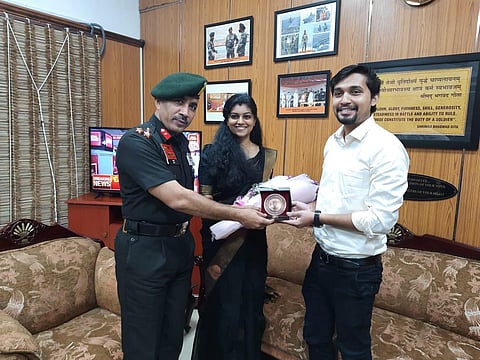 Brigadier Lalit Sharma presenting a memento to Rahul and Karthika on Monday.
