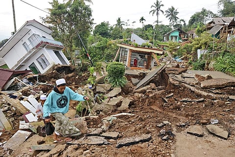 Local youths navigate their way through the rubble at a village affected by Monday's earthquake, in Cianjur, West Java, Indonesia,Nov. 23, 2022. (Photo | AP)