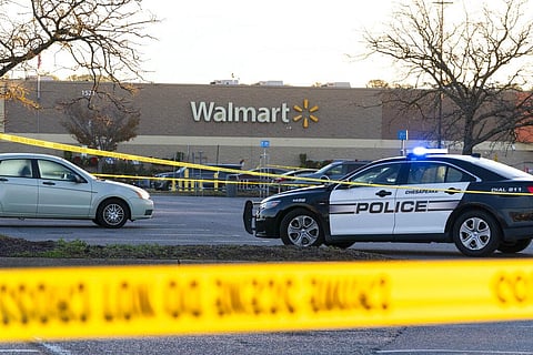 Law enforcement work the scene of a mass shooting at a Walmart,in Chesapeake, Virginia,Nov. 23, 2022. (Photo | AP)