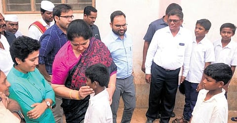 Minister Satyavathi Rathod with children at Kothaguda school in Mahabubabad