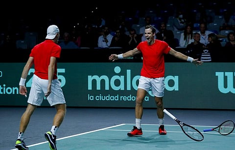 Denis Shapovalov and Vasek Pospisil of Canada celebrate after winning against Germany's Kevin Krawietz and Tim Puetz during a Davis Cup quarter-final tennis match. (Photo | AP)