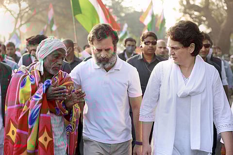 Rahul Gandhi with his sister and the party’s general secretary Priyanka Gandhi Vadra interact with a local supporter during the Bharat Jodo Yatra, in Khandwa. (Photo | PTI)