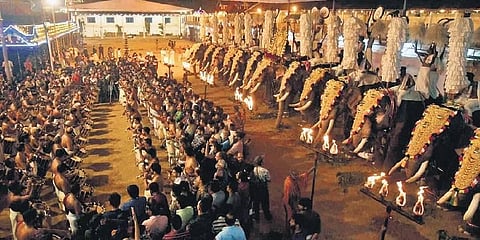 Devotees attend the festivities held as part of the annual Vrischikolsavam at the Sree Poornathrayeesa Temple in Tripunithura | a sanesh