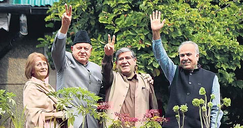 In this file image, NC leaders Mohammad Akbar Lone and Hasnain Masoodi (R) seen with party chief Farooq Abdullah (2nd from L) at his Srinagar residence, and his wife Molly Abdullah (L) (Photo| PTI)