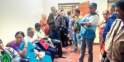 Depositors wait to fill up claim forms at the BMTC complex in Shanti Nagar | Express
