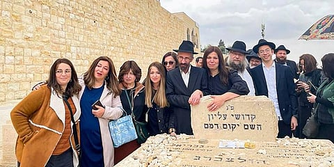 Moshe Holtzberg, one of the survivor of 26/11 Mumbai terror attack, on his father's grave by Mount Olives in Jerusalem. (Photo | PTI)