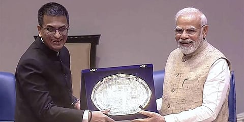 Prime Minister Narendra Modi being presented a memento by Chief Justice of India (CJI) Justice D.Y Chandrachud during the Constitution Day celebrations in the Supreme Court. (Photo | PTI)