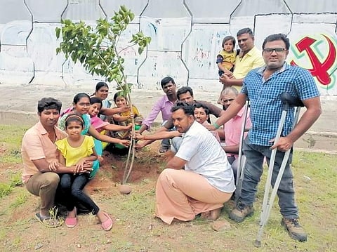 Sathish Kumar, an environmentalist, during one of his plantation drives. (Express)