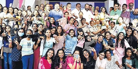General Education Minister V Sivankutty handing over the overall championship trophy to Thiruvananthapuram South sub-district on Saturday | EXpress