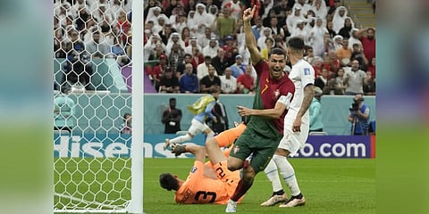 Portugal's Cristiano Ronaldo celebrates after scoring his side's opening goal during the World Cup group H soccer match between Portugal and Uruguay.(Photo | AP)