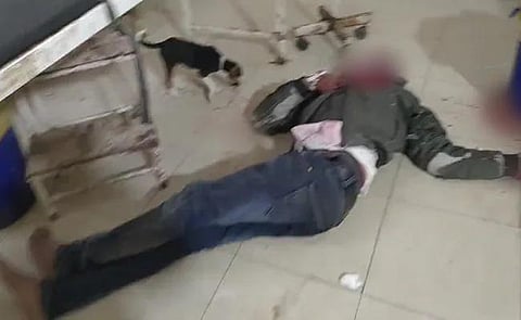 A man lying on the floor grievously injured with blood oozing out of his wounds at a UP hospital. (Screengrab)