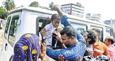 A child was taken away by Childline officials during a crackdown on child labour at Marine Driver on Tuesday. (Photo | A Sanesh, EPS)