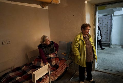 Two Women inside a bomb shelter at their building, where they have been sleeping for more than 8 months, in Mykolaiv downtown, Ukraine, Oct. 24, 2022. (Photo | AP)