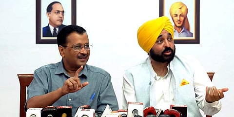 Delhi Chief Minister and AAP Convener Arvind Kejriwal with Punjab Chief Minister Bhagwant Mann addresses a press conference, in New Delhi. (Photo | PTI)