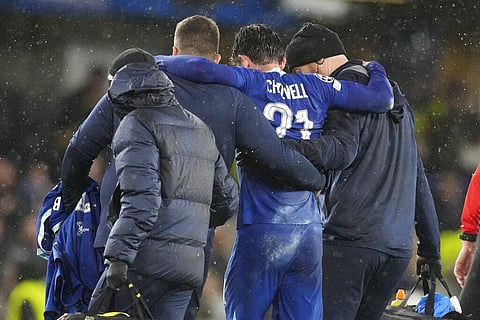 Chelsea's Ben Chilwell is helped from the pitch after sustaining an injury during the Champions League group E soccer match between Chelsea and Dinamo Zagreb at Stamford Bridge stadium. (Photo | AP)