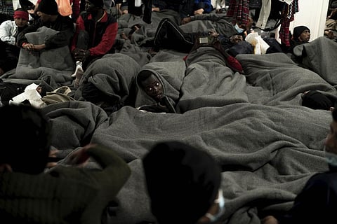 Migrants are wrapped with blankets as they gather on the deck of the Ocean Viking rescue ship, in the Strait of Sicily, in the Mediterranean Sea, Friday, Nov. 4, 2022. (Photo | AP)