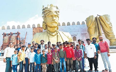 Around 50 orphans, who were taken on an excursion by Sulakshya Seva Samithi, pose for a group photo at the Ramoji Film City