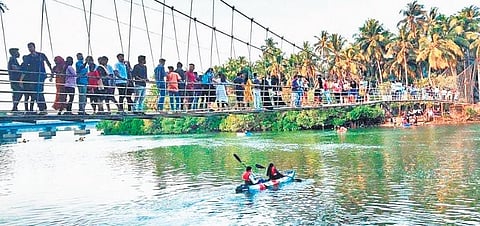 Tourists in large numbers come to see the bridge, whose concrete slabs are in bad shape, near Kemmannu in Udupi taluk | Express