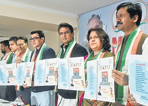 Delhi Congress President Anil Chaudhary with party in-charge Ajoy Kumar and others release the manifesto for the MCD elections on Wednesday | Parveen Negi