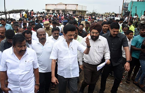 Chief Minister Mk Stalin visits people affected in the Madous cyclone and distributes the relif materials to the fishermen and their family at Kottivakkam on Saturday. Express/ Ashwin Prasath
