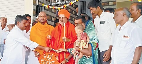 Children, including those from tribal communities, attend a special class at a school; Poojya Shivanand Swamiji of Dasoha Virkta Matha Sonna visits a house at Ghattarga with Akshara Jolige to collect