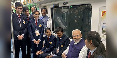 Prime Minister Narendra Modi interacts with students as he takes Metro ride from Freedom Park Metro station to Khapri Metro Station, in Nagpur. (Photo | PTI)