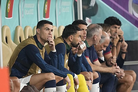 Portugal's Cristiano Ronaldo sits on the bench before the World Cup quarterfinal soccer match between Morocco and Portugal, at Al Thumama Stadium in Doha, Qatar. (Photo | AP)