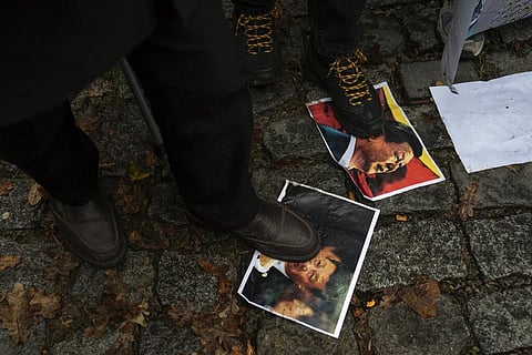 Protesters step on pictures of Xi Jinping during a protest against China's brutal crackdown on Uyghurs, in front of the Chinese consulate in Istanbul, Turkey, Nov. 30, 2022. (File Photo | AP)